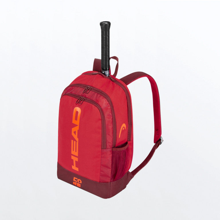 The Head Core Backpack which is for sale at GSM Sports with a tennis racket inside for illustrative purposes in red