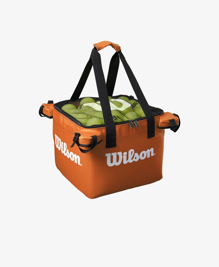 The Wilson Teaching Cart Bag in orange with tennis balls inside for display purposes available for sale at GSM Sports.