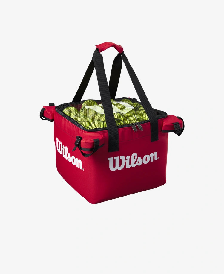 The Wilson Teaching Cart Bag in red with tennis balls inside for display purposes available for sale at GSM Sports.