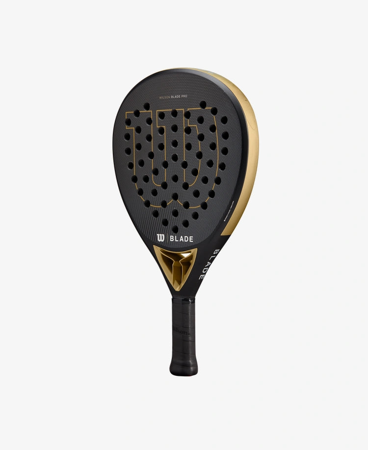      WR067221U__6432ef84d56341638e558c779f31358d 1556 × 1900px The Wilson Blade Pro V2 Padel Racket in gold colour which is available for sale at GSM Sports.