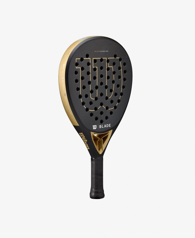      WR067221U__6432ef84d56341638e558c779f31358d 1556 × 1900px The Wilson Blade Pro V2 Padel Racket in gold colour which is available for sale at GSM Sports.