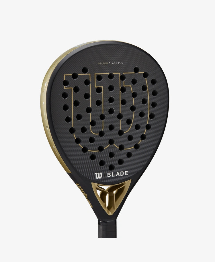      WR067221U__6432ef84d56341638e558c779f31358d 1556 × 1900px The Wilson Blade Pro V2 Padel Racket in gold colour which is available for sale at GSM Sports.