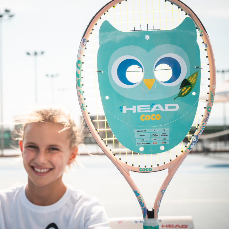 A Girl holding a Head Coco 17 Junior Tennis Racket for sale at GSM Sports