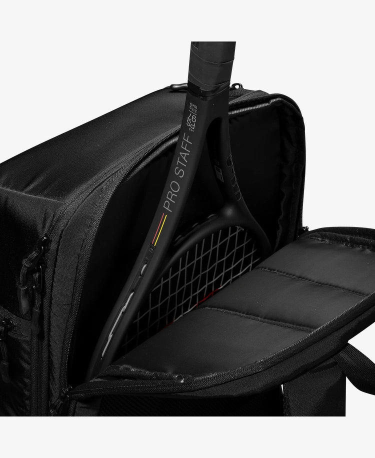 The Wilson Pro Staff V13 Super tour Backpack in black with a racket inside for display purposes which is available for sale at GSM Sports.