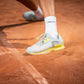 The Head Sprint Pro 3.5 Mens Clay Court and padel Court shoes in Grey and Yellow on a clay court available for sale at GSM Sports.