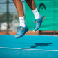 The Head Sprint Pro 3.5 Mens Tennis Shoe in Blue and Orange on a hard court available at GSM Sports